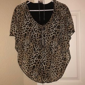 Cheetah print blouse with black flared bottoms